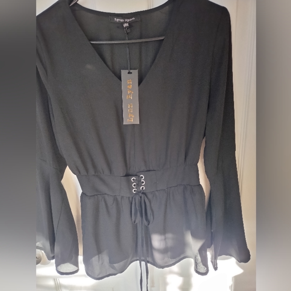 Black sheer blouse, flute sleeves,elastic waist with tie in the front size M.